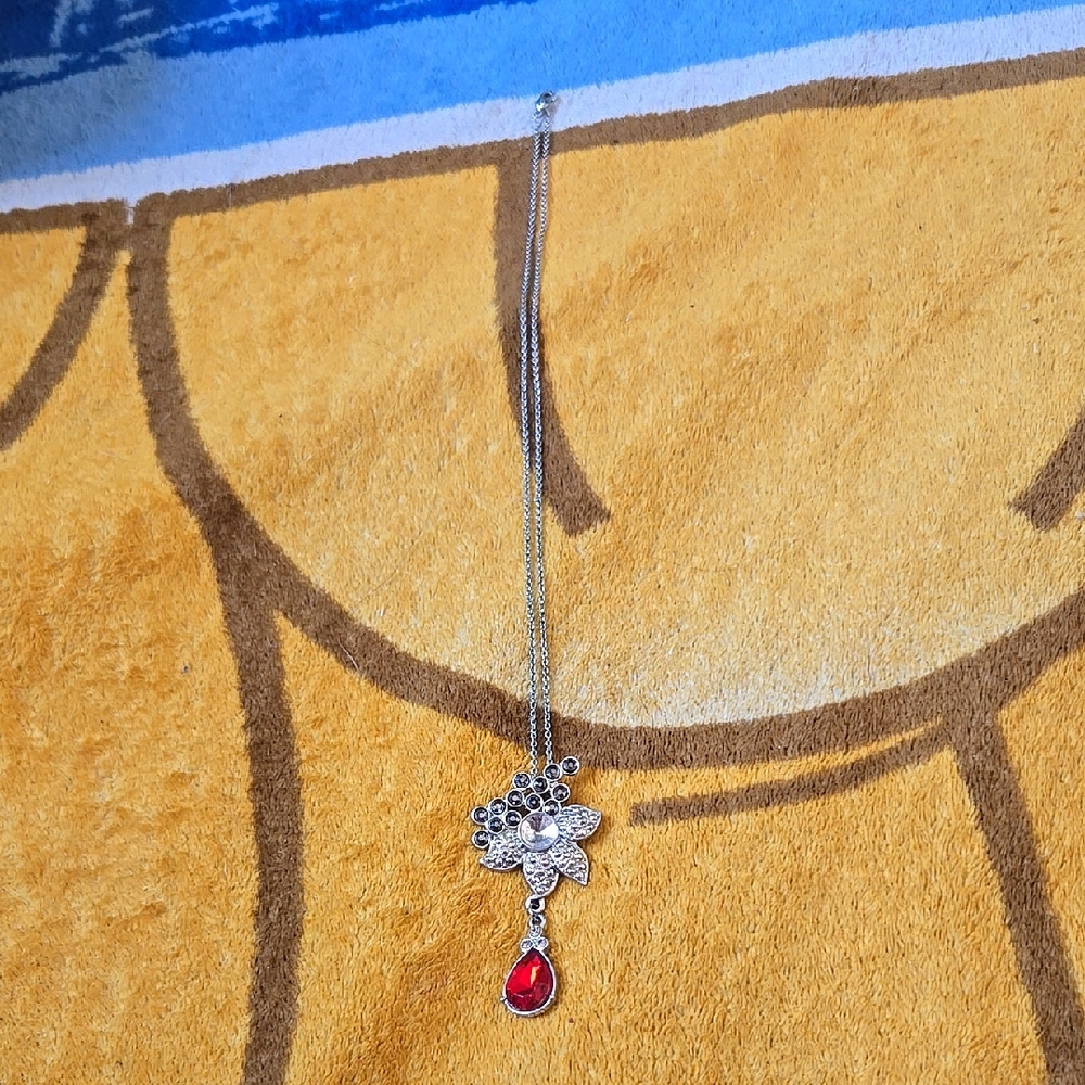 Elegant Silver Necklace with Red Gemstone Pendant